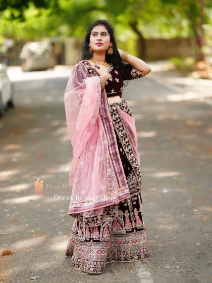 This angle showcases the flow and structure of the velvet lehenga. The rich fabric and detailed work ensure you look elegant from every perspective.