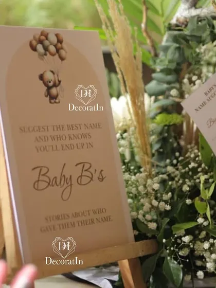 A close-up of the "Baby B's Stories" sign, part of the name suggestion game.