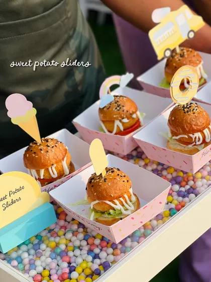 Sweet potato sliders get an ice cream-themed twist with colorful toppers shaped like ice cream cones, popsicles, and donuts.