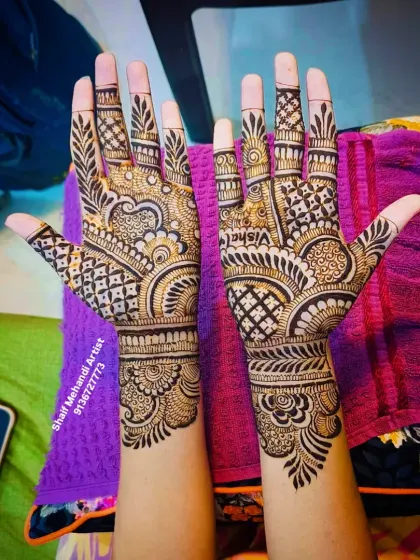 A close-up of the 'Vishal' design, showing the intricate check patterns on the fingers.
