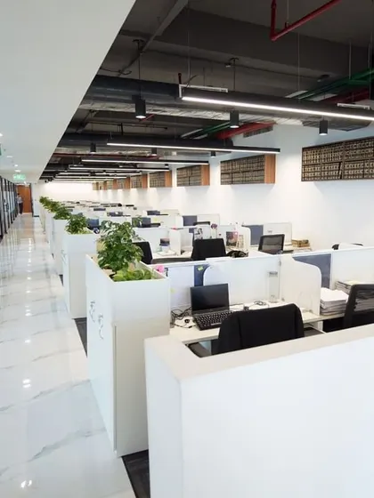 A look at the expansive open-plan workspace in our new Delhi office. The design promotes collaboration and efficiency, reflecting our commitment to a dynamic work environment for our team.