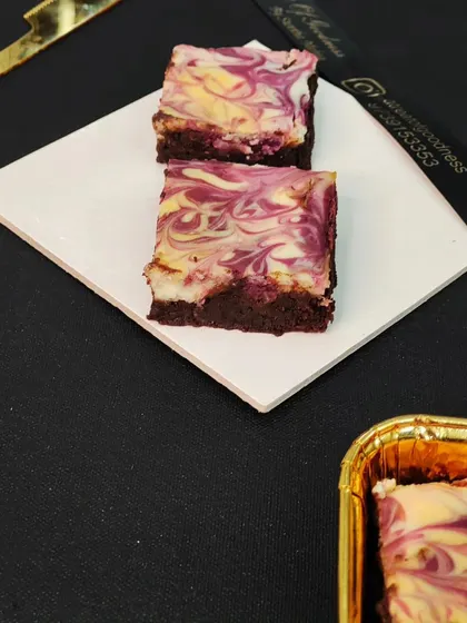 This is my marbled brownie, which beautifully swirls rich chocolate brownie batter with a complementary flavor. The result is a treat that is as visually appealing as it is delicious.