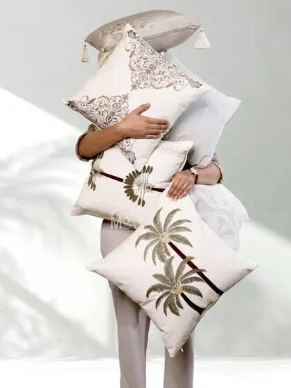 Our latest collection of cushion covers celebrates artistry in every thread. This assortment features a mix of botanical elegance, including palm trees, and timeless trellis patterns in earthy neutrals.