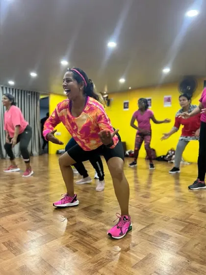 The energy in a studio Zumba class is incredible. Here I am leading a group through a fun, high-intensity routine, making sure everyone is sweating with a smile on their face.