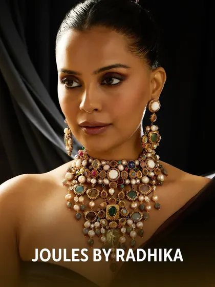 Another stunning close-up of the layered, multi-gemstone necklace, showing its texture and vibrant colors.