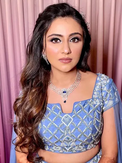 A portrait of the bride, looking elegant and poised with her simple yet beautiful wavy hairstyle.