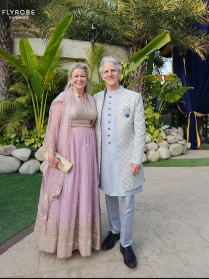 This happy couple is all smiles, dressed in beautiful pastel ethnic wear for a day function. Renting makes it easy to dress for any occasion.