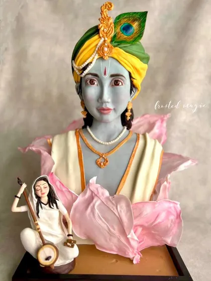 This award-winning sculpted cake of Krishna and Meera is one of my proudest creations. I poured my heart into sculpting every detail by hand, from the expression on their faces to the delicate wafer paper lotus petals. It was an absolute honour to win first place at Cakeology for this piece.