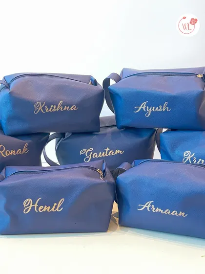 Personalized dopp kits or travel pouches for each member of the groom's crew, embroidered with their names in elegant gold script.