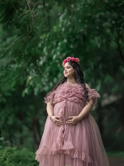 A beautiful, soft-lit portrait in a dusty rose gown. The texture of the gown and the natural background create a romantic feel.