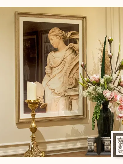This wall decor, titled "A Symphony of Victorian Imagery," captures the beauty of classical sculpture in a framed print. It pairs beautifully with other antique-inspired pieces to create a cohesive look.