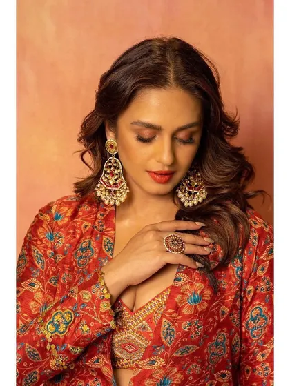 Diwali scenes with Huma Qureshi. I styled her in this red printed three-piece set from Label Anushree, perfect for festive celebrations. The look is layered, vibrant, and full of energy.