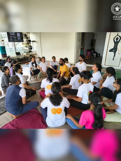 A circle of trust and learning. Our TTC students gather for a discussion with their guru, a space for asking questions, sharing insights, and building a strong community bond.