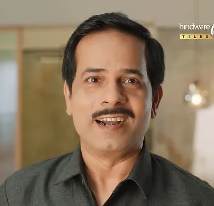 A close-up of the main character from the Hindware commercial. His expressive face is the focus, with his dark shirt providing a neutral canvas.
