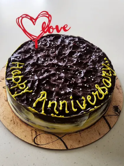 A special anniversary cake for a couple who loves coffee flavors. This is my signature dark chocolate cake soaked in Kahlua, making it a rich and boozy treat to celebrate their love.