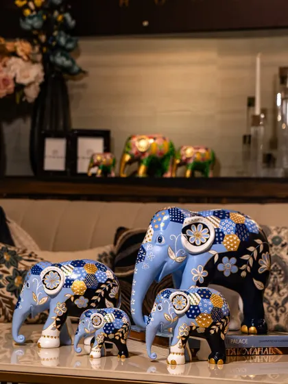 Another view of the blue patchwork elephants, showcasing their varying sizes and complementary designs. These exquisite sculptures are symbols of creativity, heritage, and wildlife conservation.