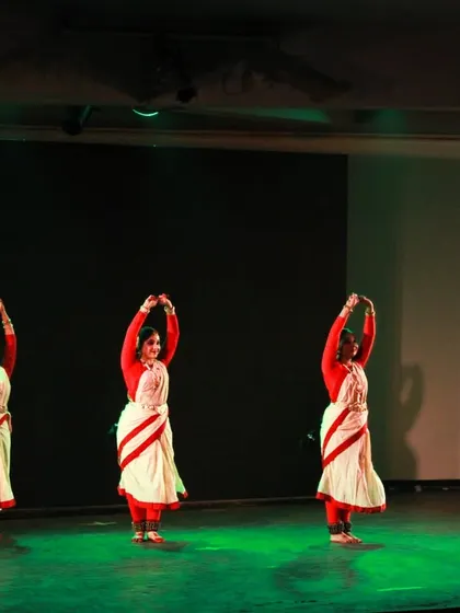 My dancers in perfect synchrony during 'Mix & Match'. The costumes themselves are an integral part of the choreography, representing the classic white and red border saree style, a symbol of tradition.