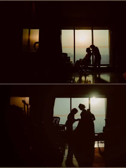 A silhouette of the bride getting ready against the sunset, a beautiful and artistic getting-ready shot.