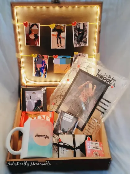 This hamper is curated to be a box full of memories, featuring a photo garland, a custom mug, and other personal touches.