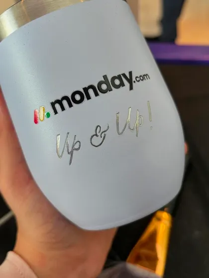 Besides names, I also engraved fun phrases like "Up & Up!" on the tumblers for the Monday.com event. It's a great way to incorporate brand messaging into a personalized gift.