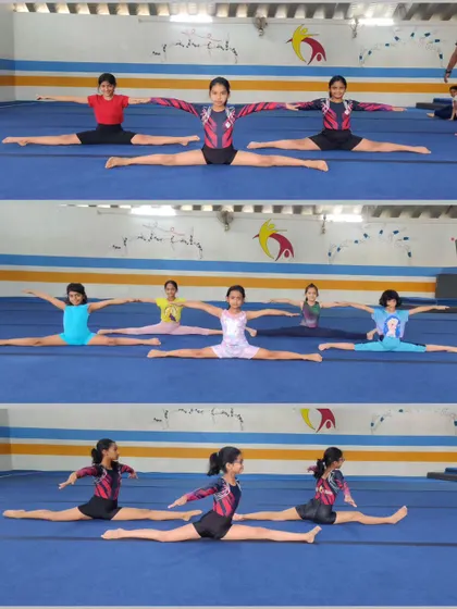 A group of our gymnasts holding their middle splits. Consistent practice of these stretches is what leads to such impressive flexibility.