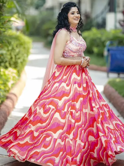 A twirl to show off the beautiful, flowy lehenga. The hairstyle and makeup are designed to be fun and festive, just like the Haldi ceremony itself.