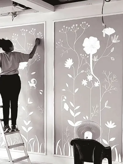A duplicate image of me working on a 3D texture mural.