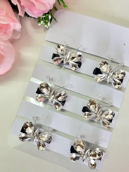These silver stone butterfly clips are perfect for accessorizing a sleek bun or a modern braid.