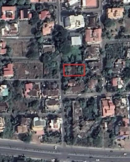 A satellite image indicating the site for The Nest in Panjim. The urban context of a tight grid with adjacent plots directly informed our design strategy to create an inward-looking building with vertical courtyards.