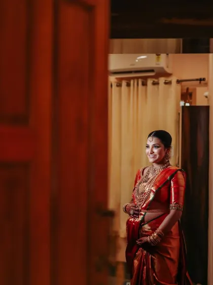 A candid moment of anticipation and joy. Our sarees are designed to be a comfortable and elegant part of these unforgettable memories.