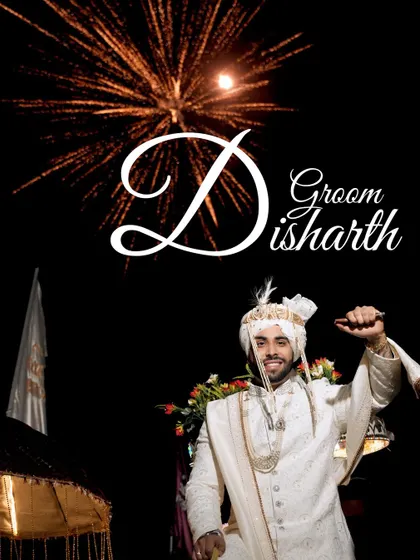 A celebratory shot of the groom, Disharth, during his Baraat, with fireworks in the background.