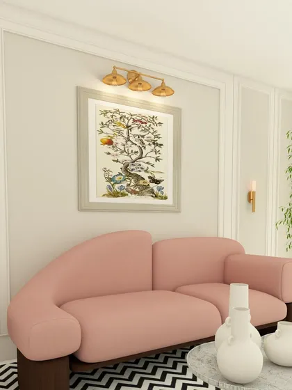 A living room design tip in action. We've used a light wall color, an eye-catching pink sofa, and wall cladding to make this room look expensive and well-designed.