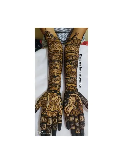 This full-arm design combines personal portraits with spiritual elements. It features the bridal couple on the palms, with Ganesha figures and peacocks on the arms.