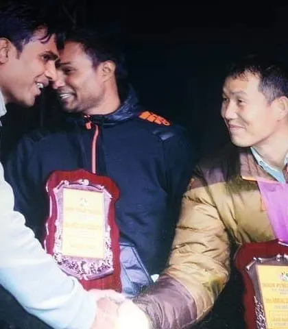 A moment of mutual respect and celebration with fellow coaches and masters. We are all part of a larger martial arts fraternity.