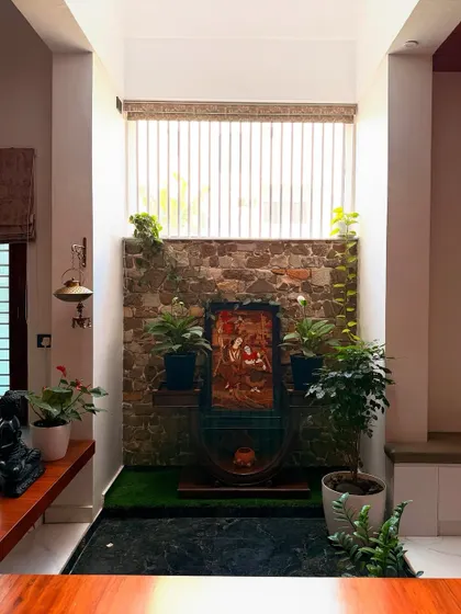 A quiet, contemplative corner in the Haritha and Harinath residence. We created this small internal courtyard with a stone accent wall and natural light from above to serve as a tranquil green niche.