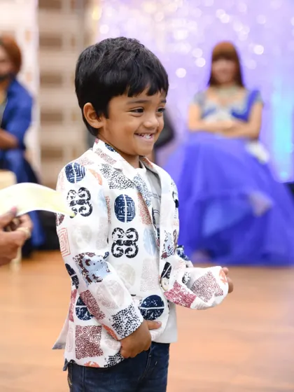 A candid photo capturing the birthday boy's genuine, happy smile.
