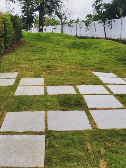 The sculpted mounds and geometric paving at this industrial site show our approach of transforming ordinary spaces into engaging environments.