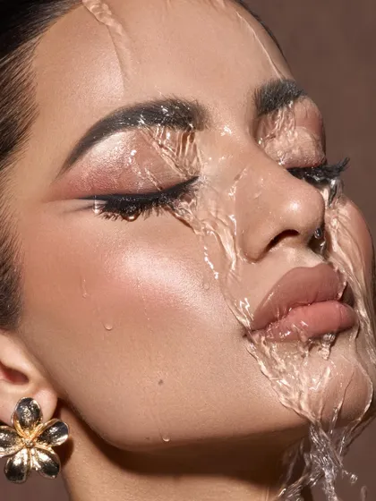 A closer crop of our water and skin series, this image focuses on the distortion and beauty created by the moving water. It transforms the face into a living canvas, resulting in a powerful and abstract beauty photograph.