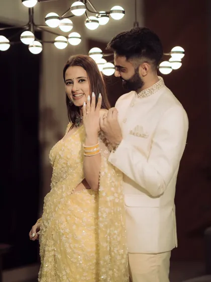 A beautiful shot highlighting the engagement ring and the couple's happy expressions. I focus on both the details and the emotions.