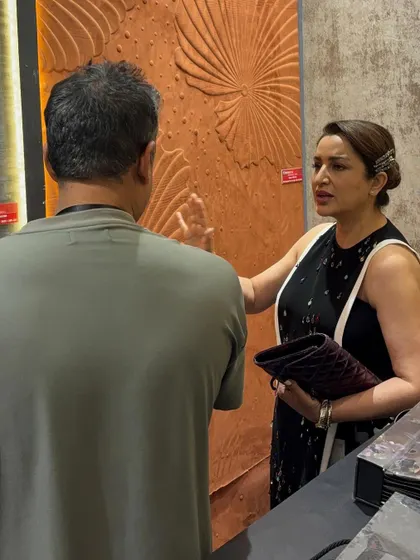 Tisca Chopra experiencing the unique texture of our 3D wallcoverings. We encourage a tactile exploration of our products, as luxury is as much about feel as it is about appearance.