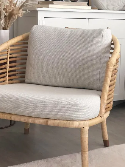 A closer look at the single-seater armchair from my modern collection. Notice the detailed weaving on the arms and the comfortable, thick cushions, which are standard for my upholstered pieces.
