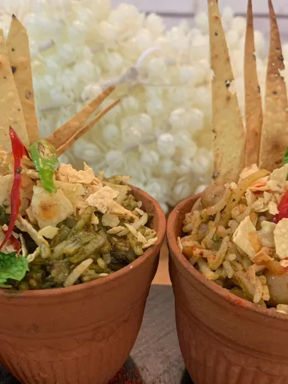 A close-up of our bhel puri served in traditional terracotta kulhads. This presentation style not only looks beautiful but also adds an earthy flavor, elevating a simple street food snack into a gourmet experience.