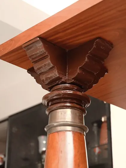 A close-up of the carved wooden capital on one of the pillars used in the pooja room. We sourced these traditional elements from Ambur and integrated them into the contemporary design to add history and character.