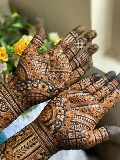 This is a detailed view of my intricate bridal henna work. Each design is unique, combining traditional patterns like paisleys and mandalas with fine-line fillers to create a stunning, full-coverage look for your special day.