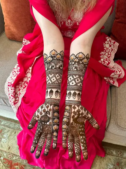 A classic bridal design featuring peacocks, lotuses, and elephants, perfect for a traditional wedding.