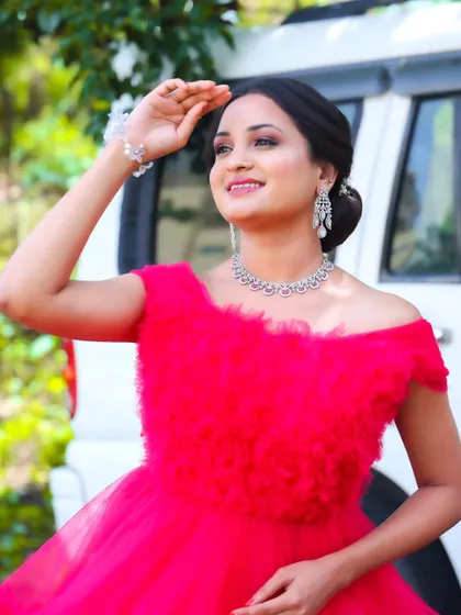 Another shot from the pre-wedding shoot. The makeup is designed to look flawless in bright, outdoor lighting, giving her a fresh and ethereal glow.