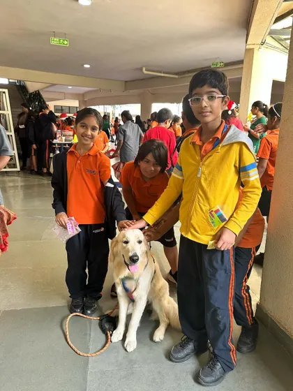 The dogs and I had a wonderful time at a school's winter carnival. Surrounded by kids and food, they were perfectly behaved, showing their potential as therapy dogs. I hope more schools open their doors to the benefits of having dogs around children.