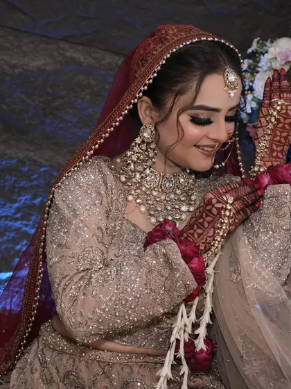 The bride's happiness shines through in this photo. The makeup is soft and radiant.