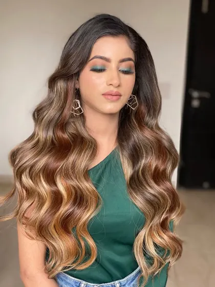 These classic voluminous waves are perfect for any occasion. The extensions add that necessary body and length, allowing for a glamorous, side-swept style that holds all day.
