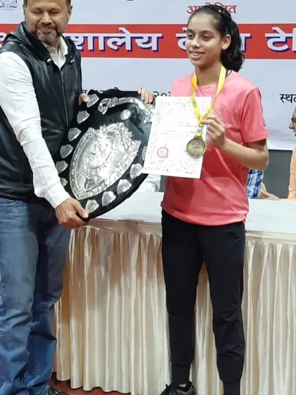 Another shot of Ananya Chande with her winner's shield at the inter-school table tennis competition. She is a role model for her peers.